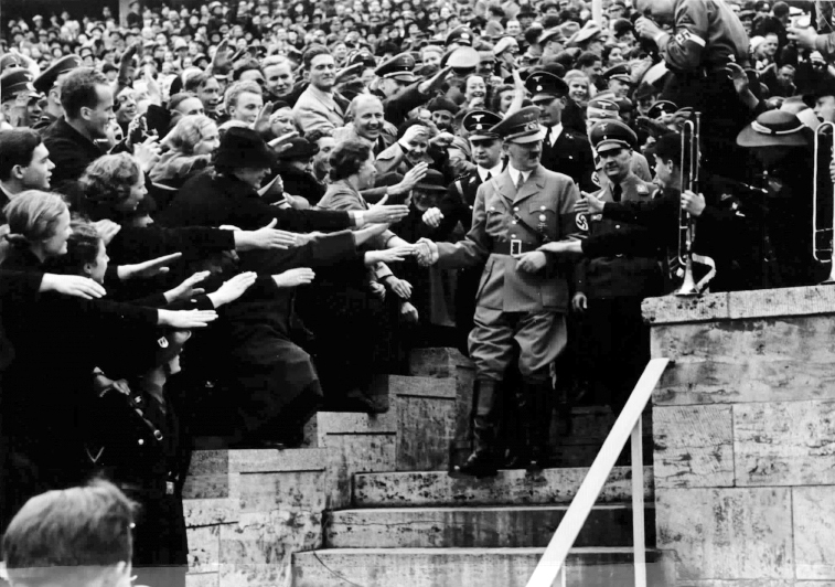 Adolf Hitler arrives at the Olympic stadium before his May day speech in Berlin